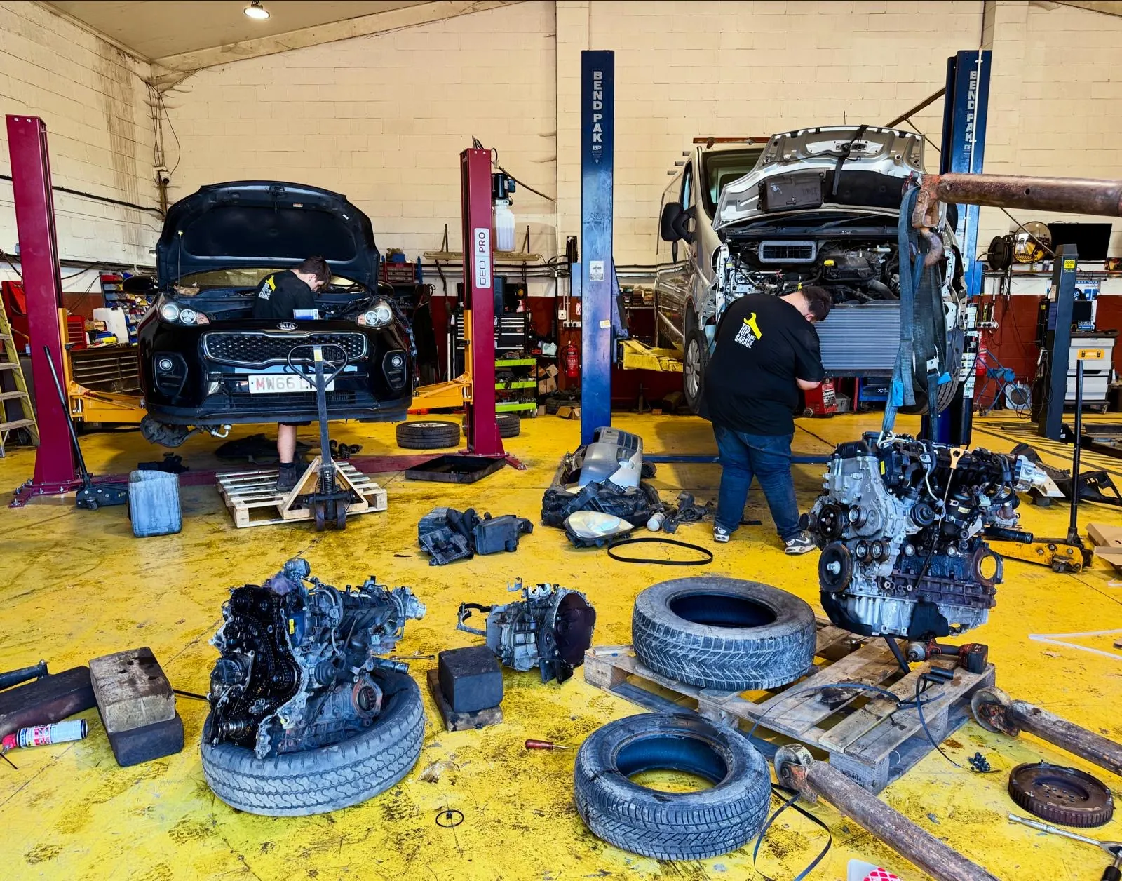 Mechanics carrying out mechanical repairs in the workshop